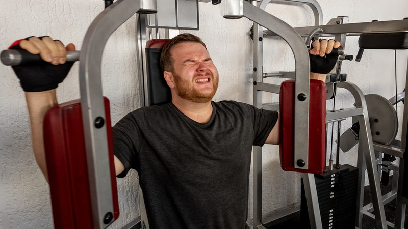 Man struggling at the gym